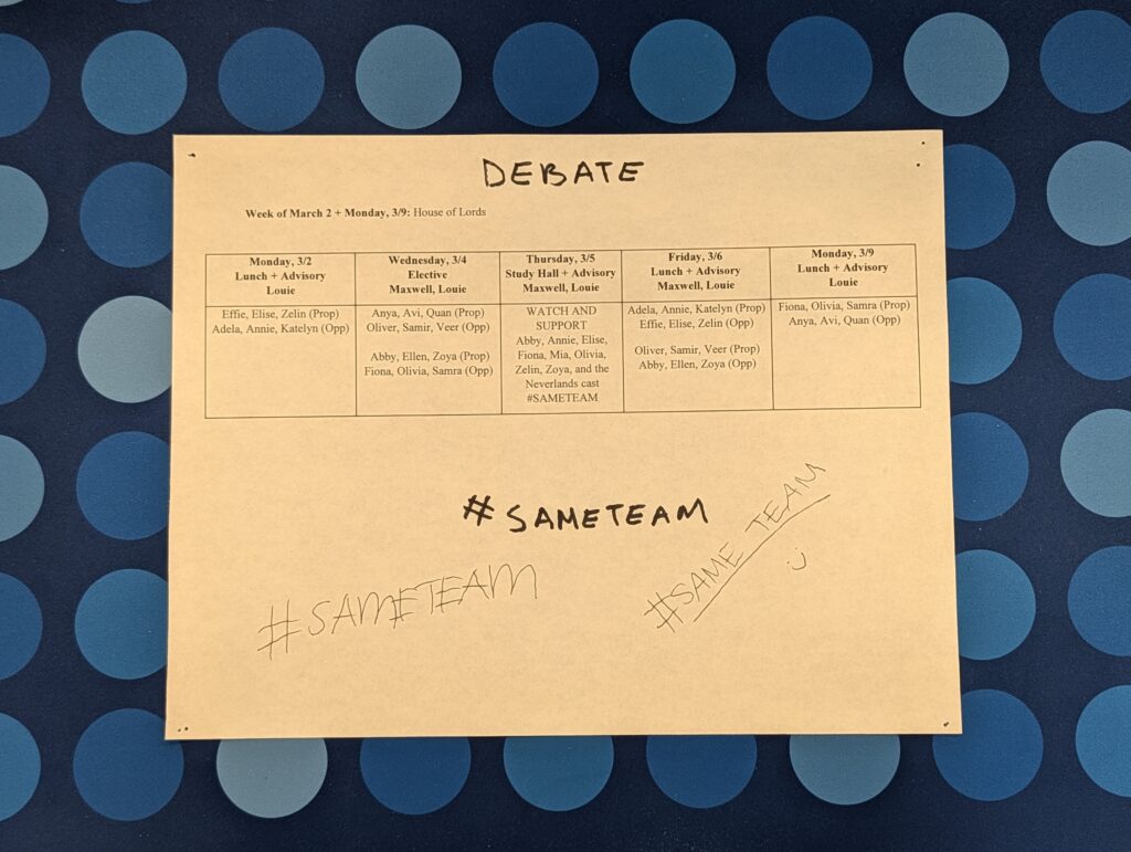 Mock Debate schedule with #SameTeam being scribbled on by students.